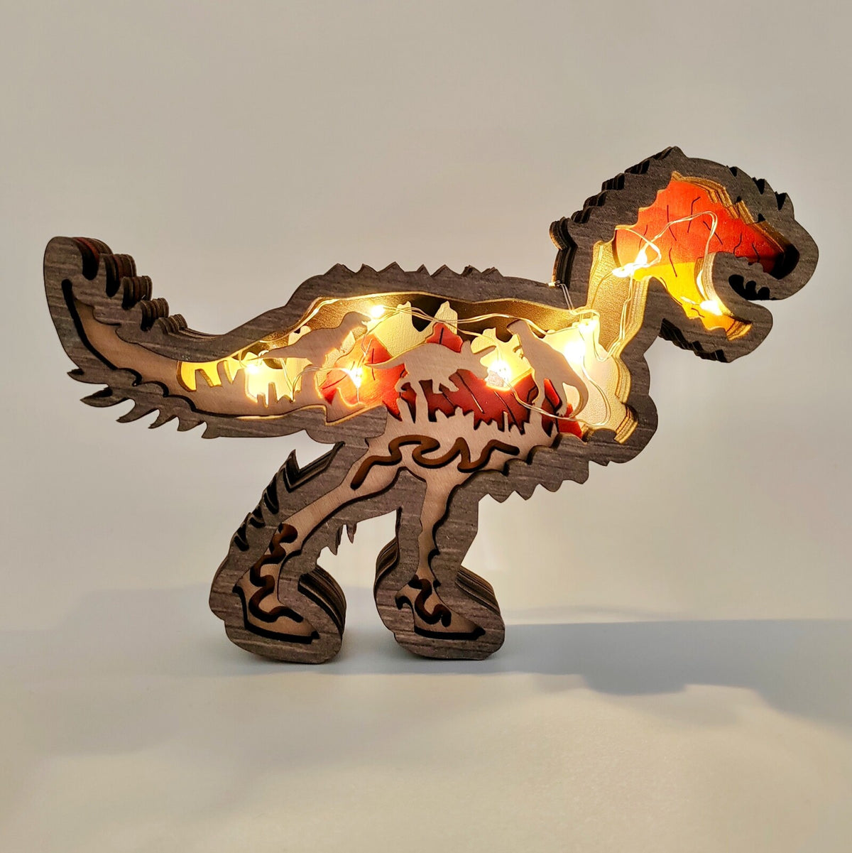Sculpture dinosaure petit T-rex en bois